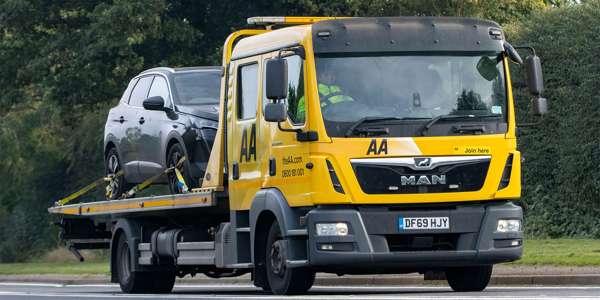 New car on breakdown recovery truck